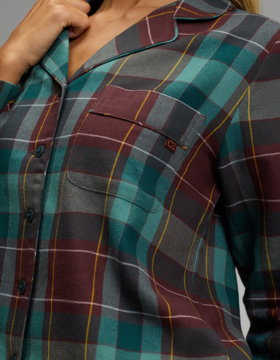 Cozy Earth Women’s Farmhouse Long Sleeve Pajama Top in a burgundy, teal, and yellow plaid pattern, featuring a chest pocket and a notched collar.