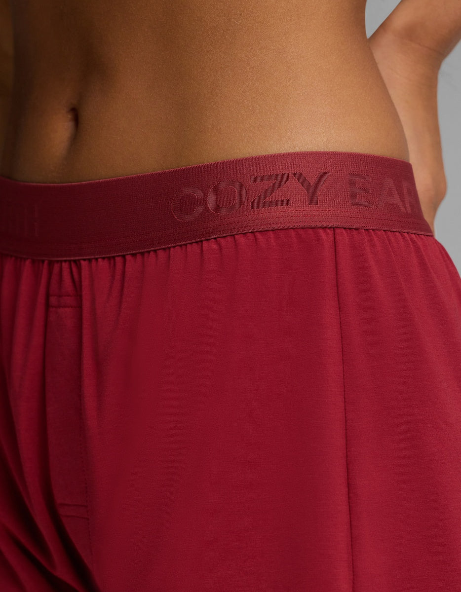 Close-up of burgundy Women’s First Layer Pajama Boxer Short featuring an elastic waistband with text branding.