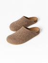 The Lakehouse Clog by Cozy Earth are brown woolen slip-on slippers with a cork sole, viewed from above. They feature a minimalist design perfect for indoor use against a light grey background. |Color:Chestnut