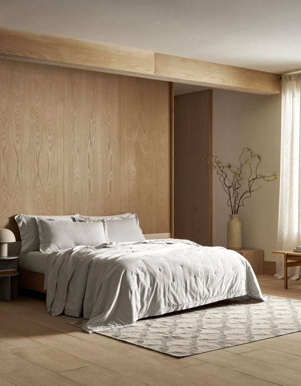a bed featuring Cozy Earth Soft Wash Quilt