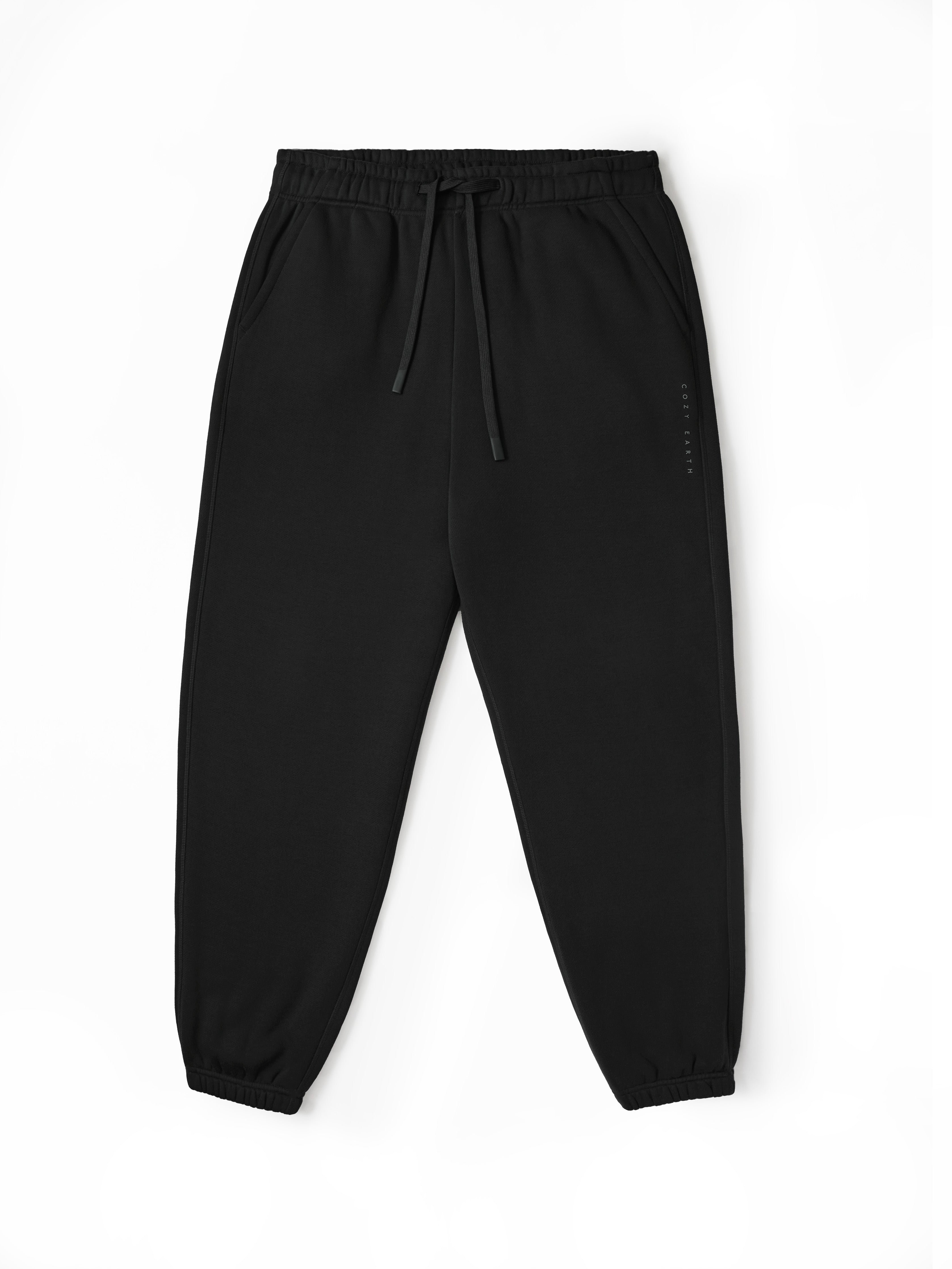 Flat lay of black cityscape sweats with white background 