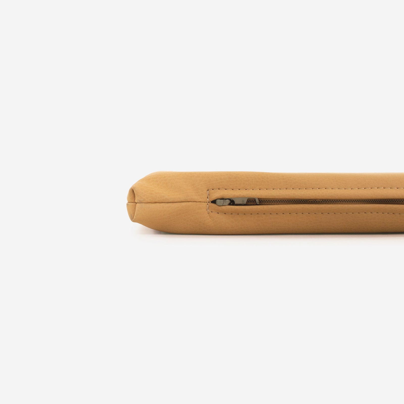 A close-up of the Gathre Wholesale Padded Changing Mat, tan and textured, lies flat with a partially unzipped zipper visible against a plain white background.