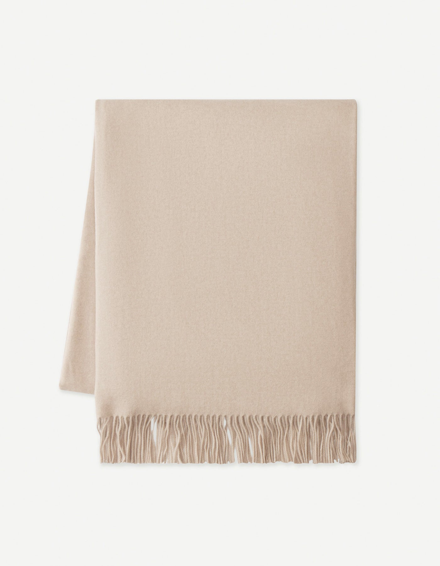 The Cozy Earth Cashmere Tassel Throw, shown neatly folded with a tasseled edge, is displayed on a white background.