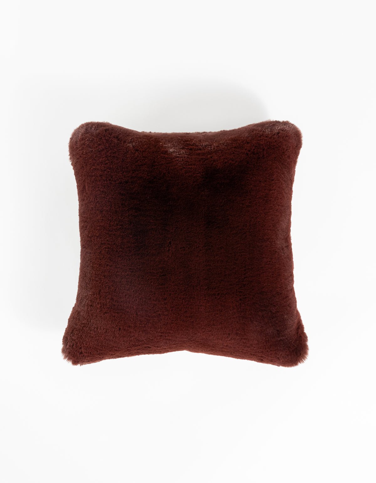 The Cuddle Pillow - Last Chance by Cozy Earth is a square, plush dark brown pillow with a soft, fuzzy texture, shown against a white background.