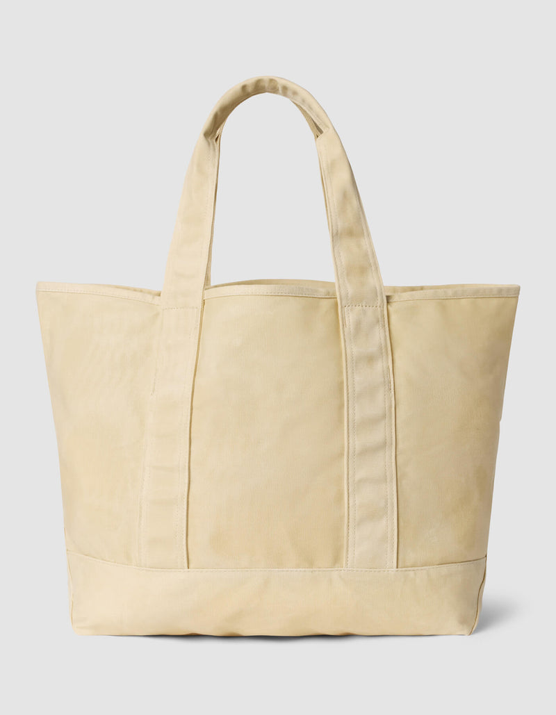 The Cozy Earth Waxed Canvas Tote, large and beige with two sturdy handles, stands upright against a plain light gray background.