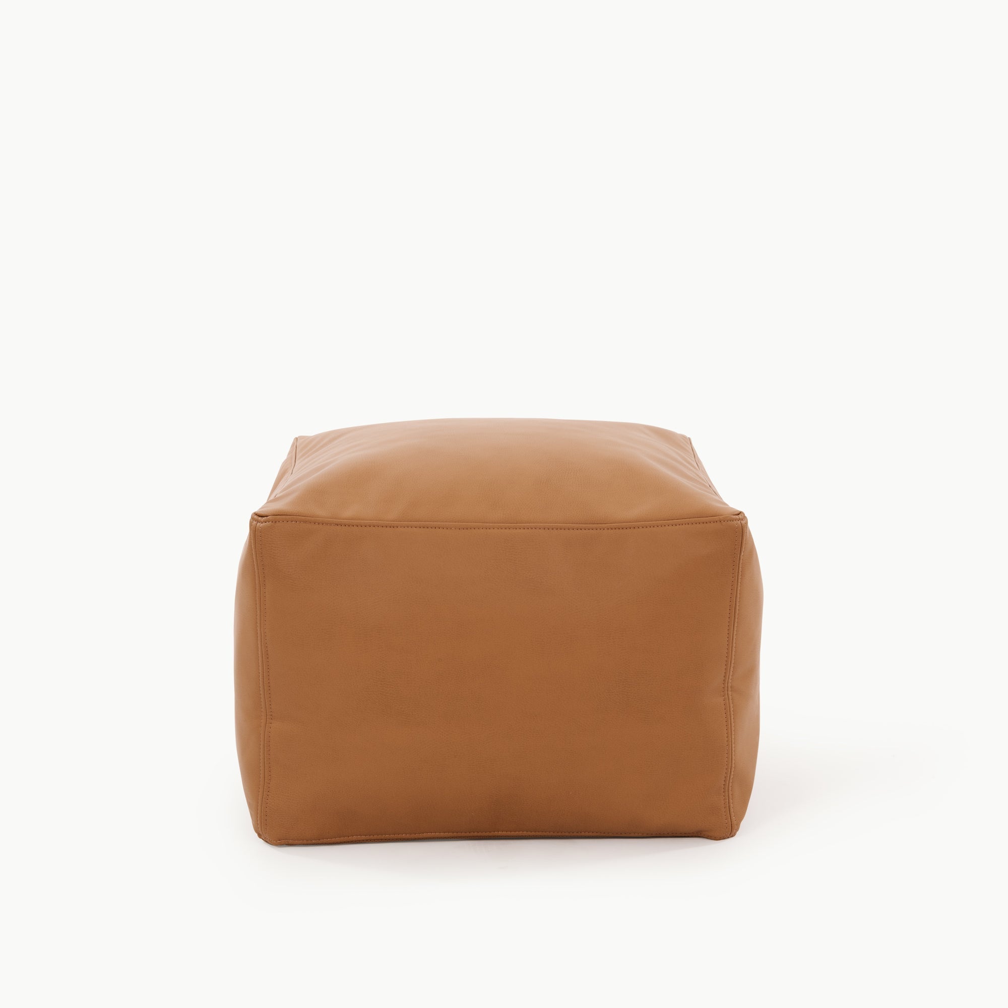 The Gathre Wholesale Pouf is a square, tan leather ottoman with smooth surfaces and visible stitching, shown against a plain white background.
