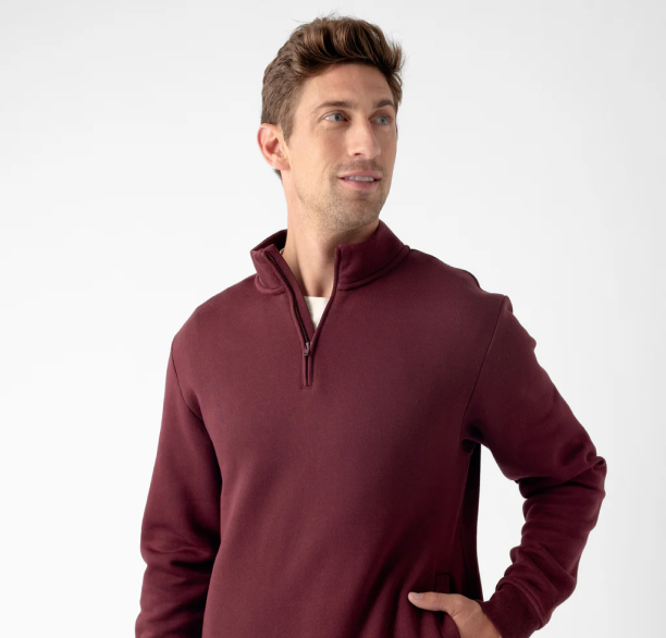 A man wears Cozy Earth CityScape Quarter Zip sweatshirt.