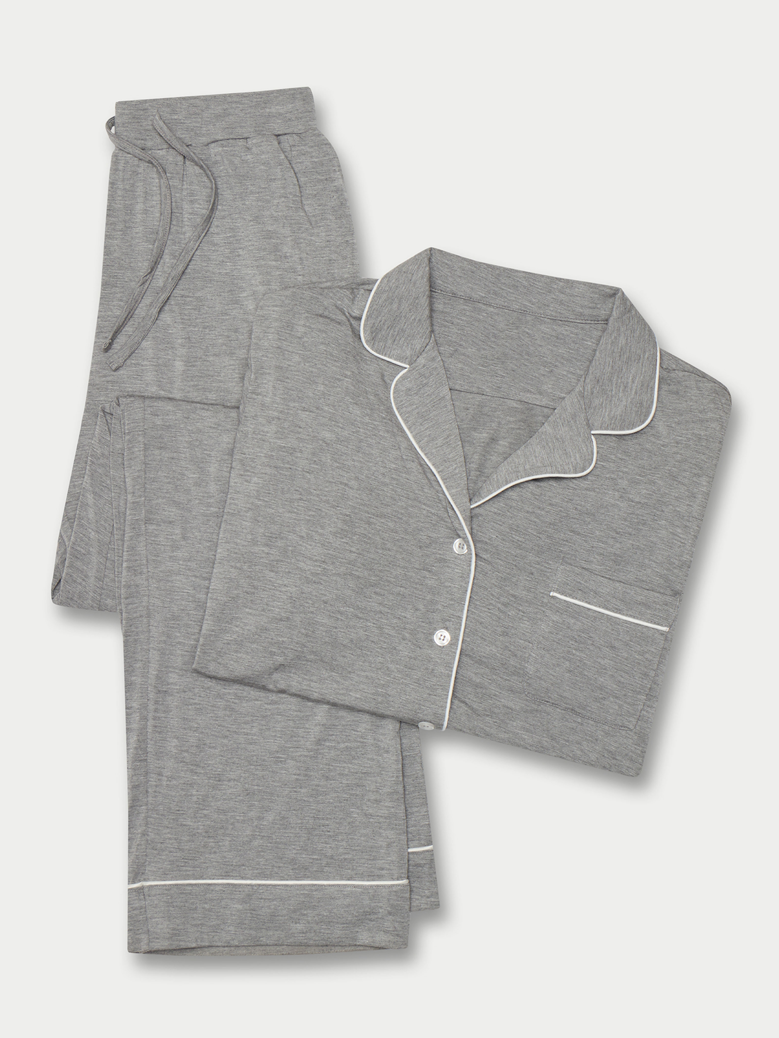 Light Grey Long Sleeve Pajama Set. The photo was taken close up, showing off the print of the pajamas. 