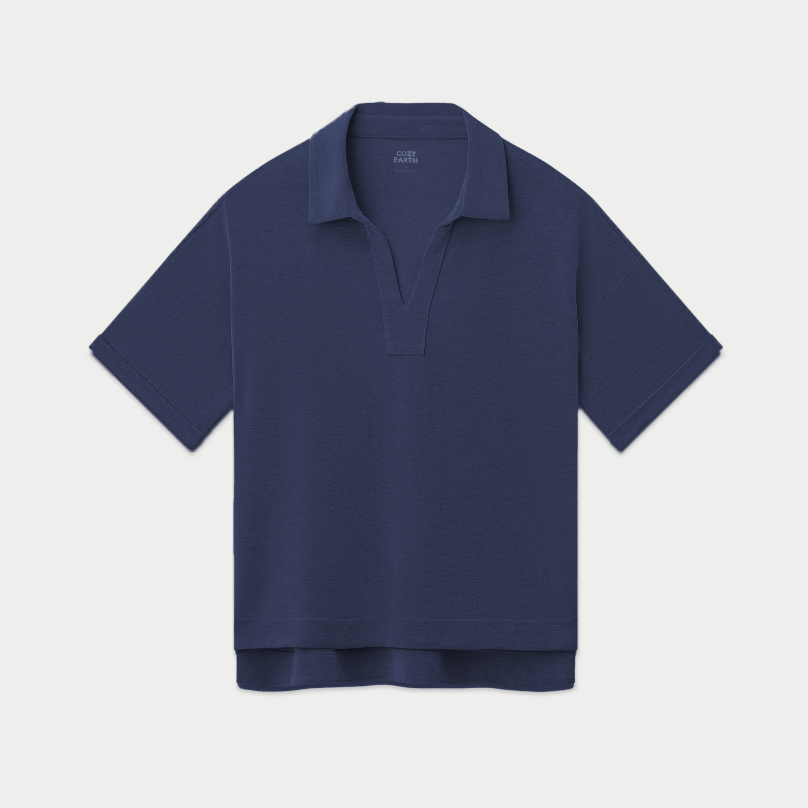 A Women's Modern Modal Polo by Cozy Earth, in navy blue with short sleeves and a relaxed fit. It features a contemporary collar design and a hidden placket, displayed flat against a plain white background.