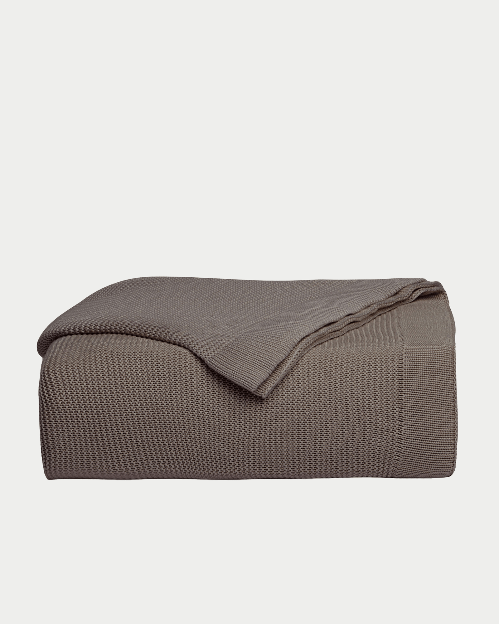 Charcoal cloud knit blanket folded with white background 