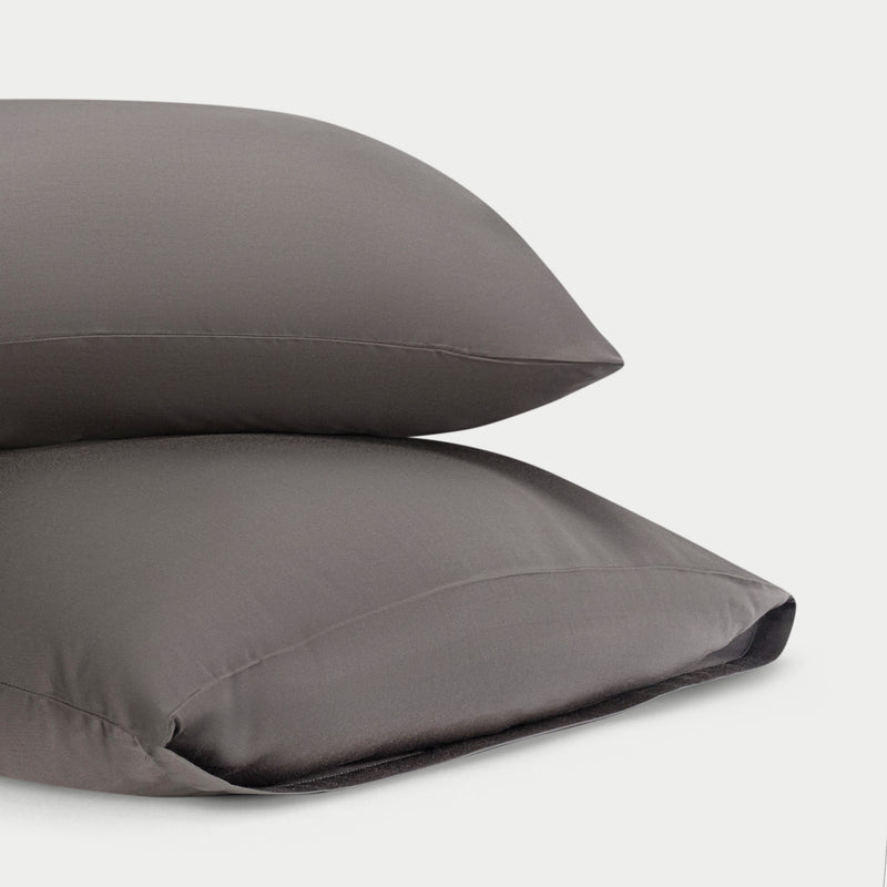Two standard/king charcoal pillowcases with plain background