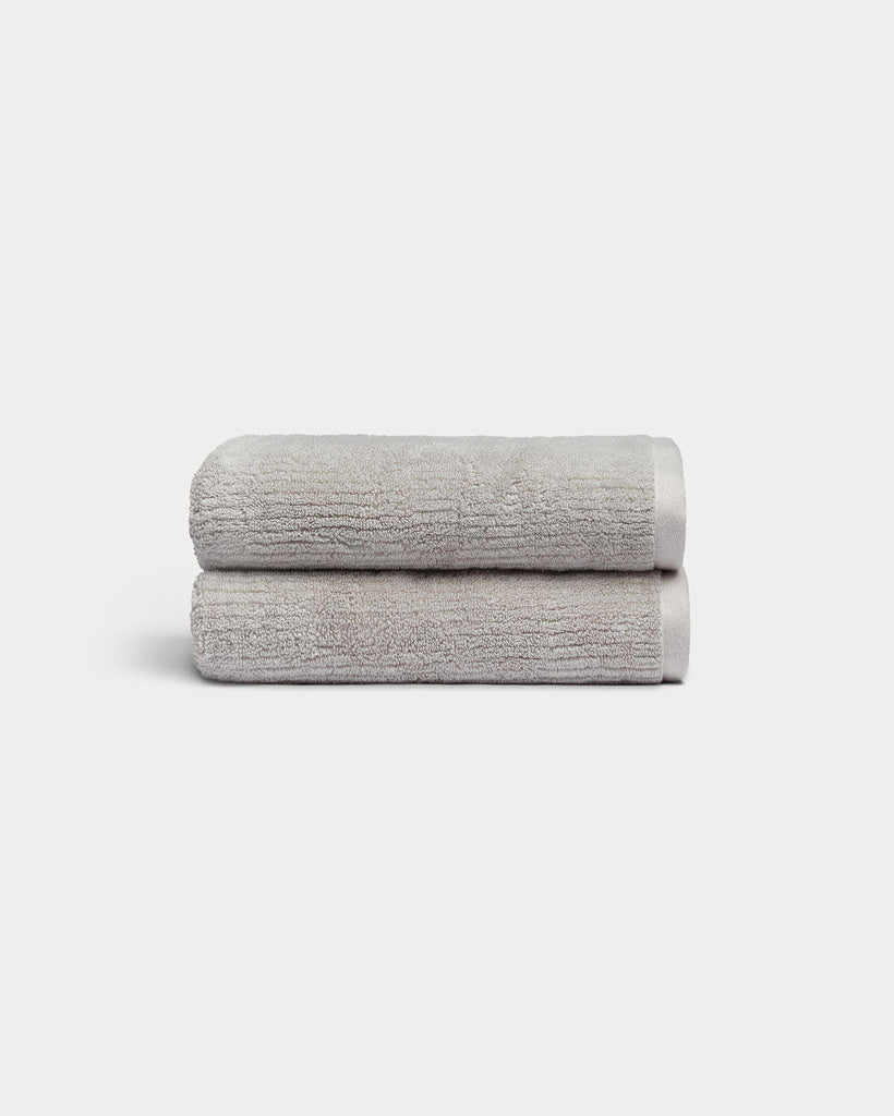 Ribbed Terry Hand Towels in the color Light Grey. Photo of product taken with a white background. 