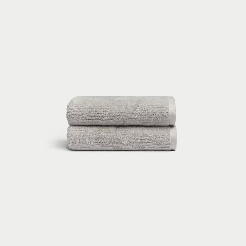 Ribbed Terry Hand Towels in the color Light Grey. Photo of product taken with a white background.