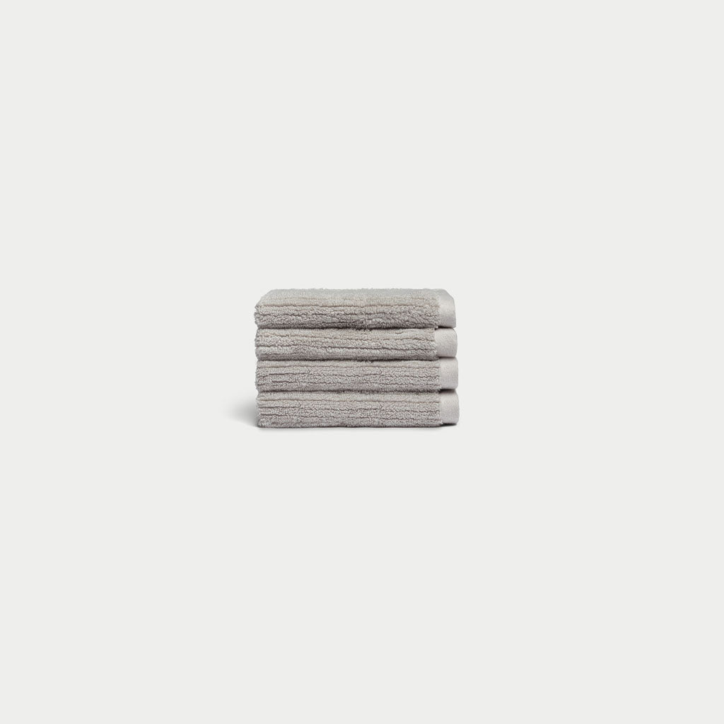 Ribbed Terry Wash Cloths in the color Light Grey. Photo of product taken with white background. 