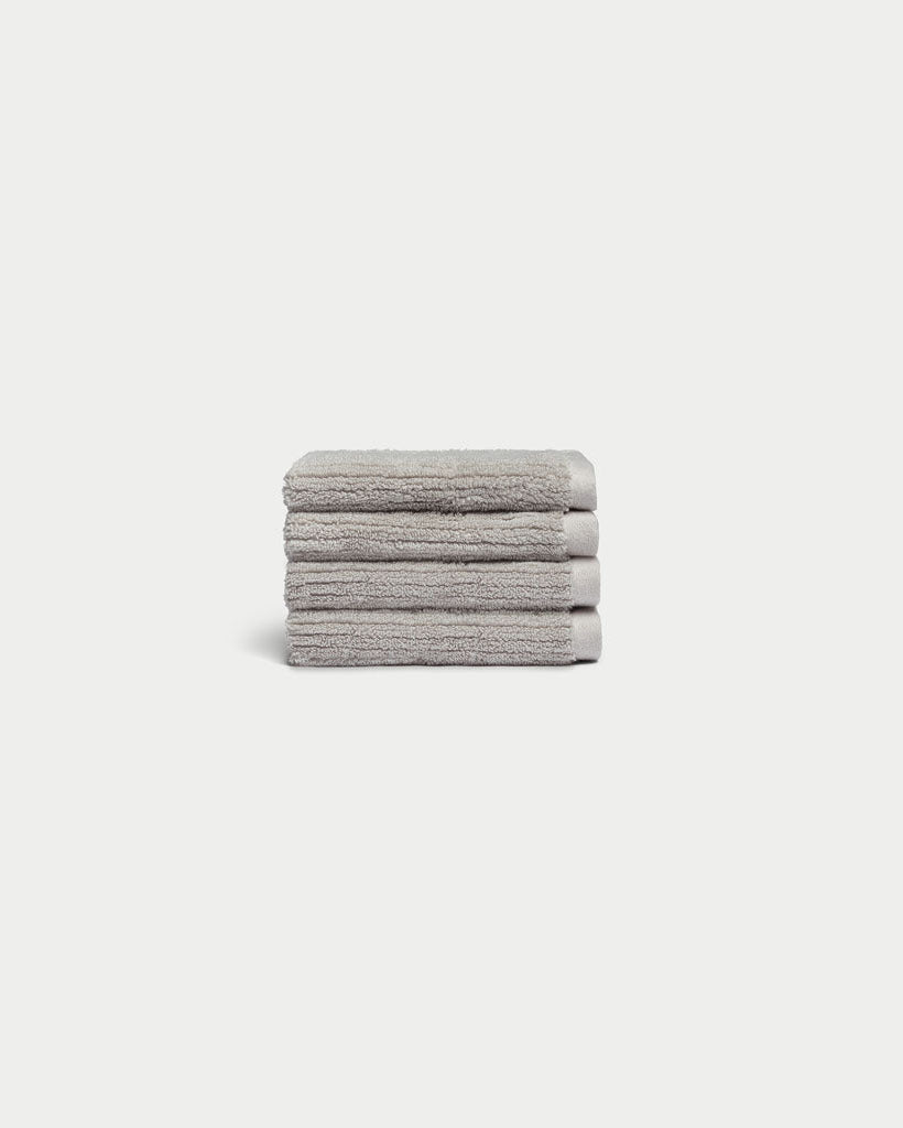 Ribbed Terry Wash Cloths in the color Light Grey. Photo of product taken with white background. 