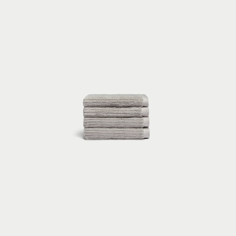 Ribbed Terry Wash Cloths in the color Light Grey. Photo of product taken with white background.