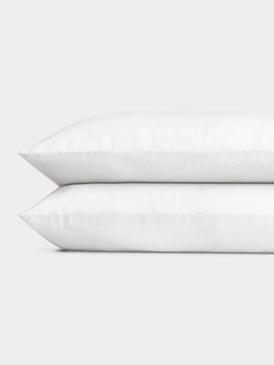 White Linen Bamboo Pillow Shams photographed over a white background. |Color: White