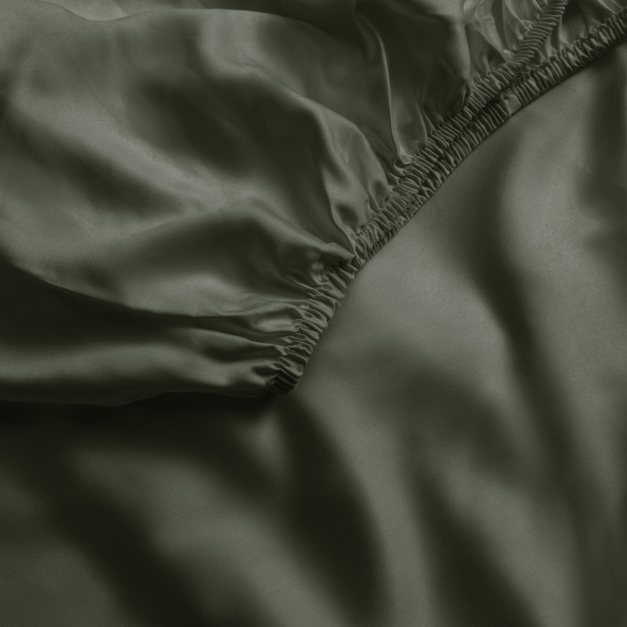 Close up of olive fitted crib sheet |Color:Olive