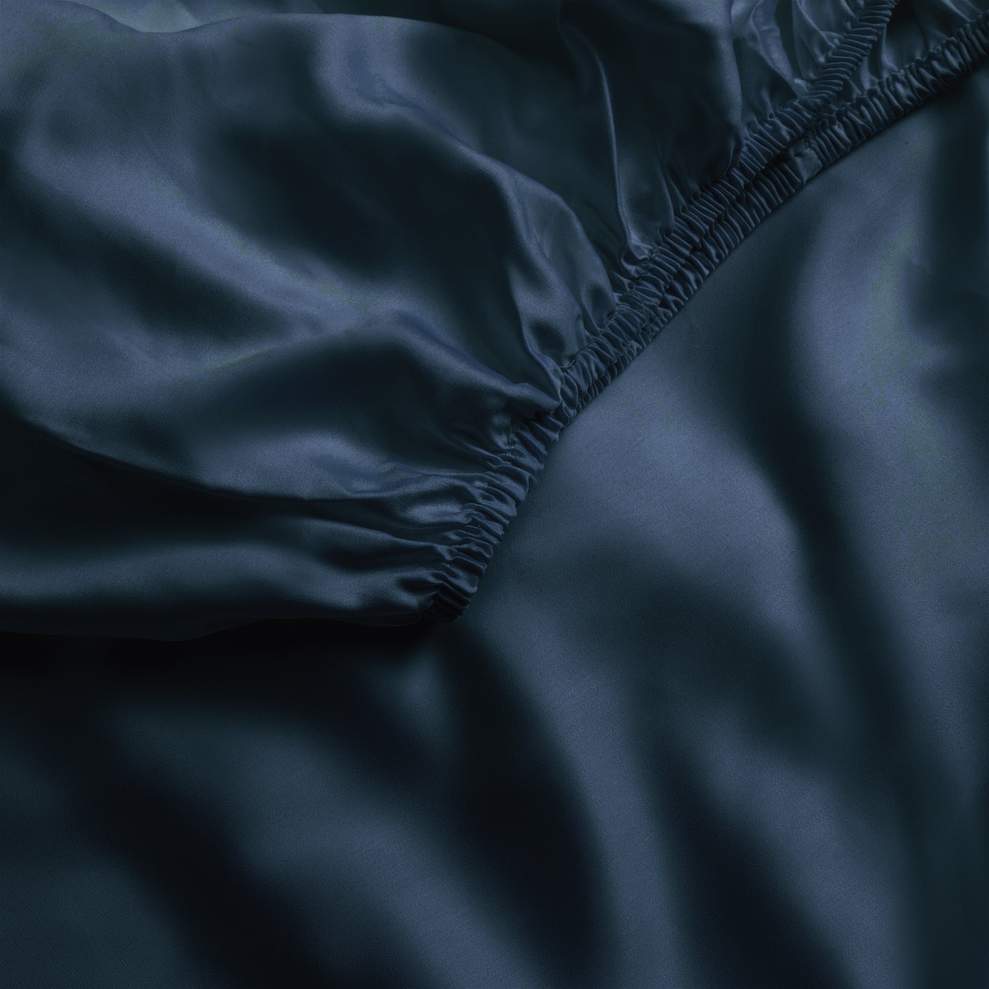 Close up of navy fitted crib sheet 