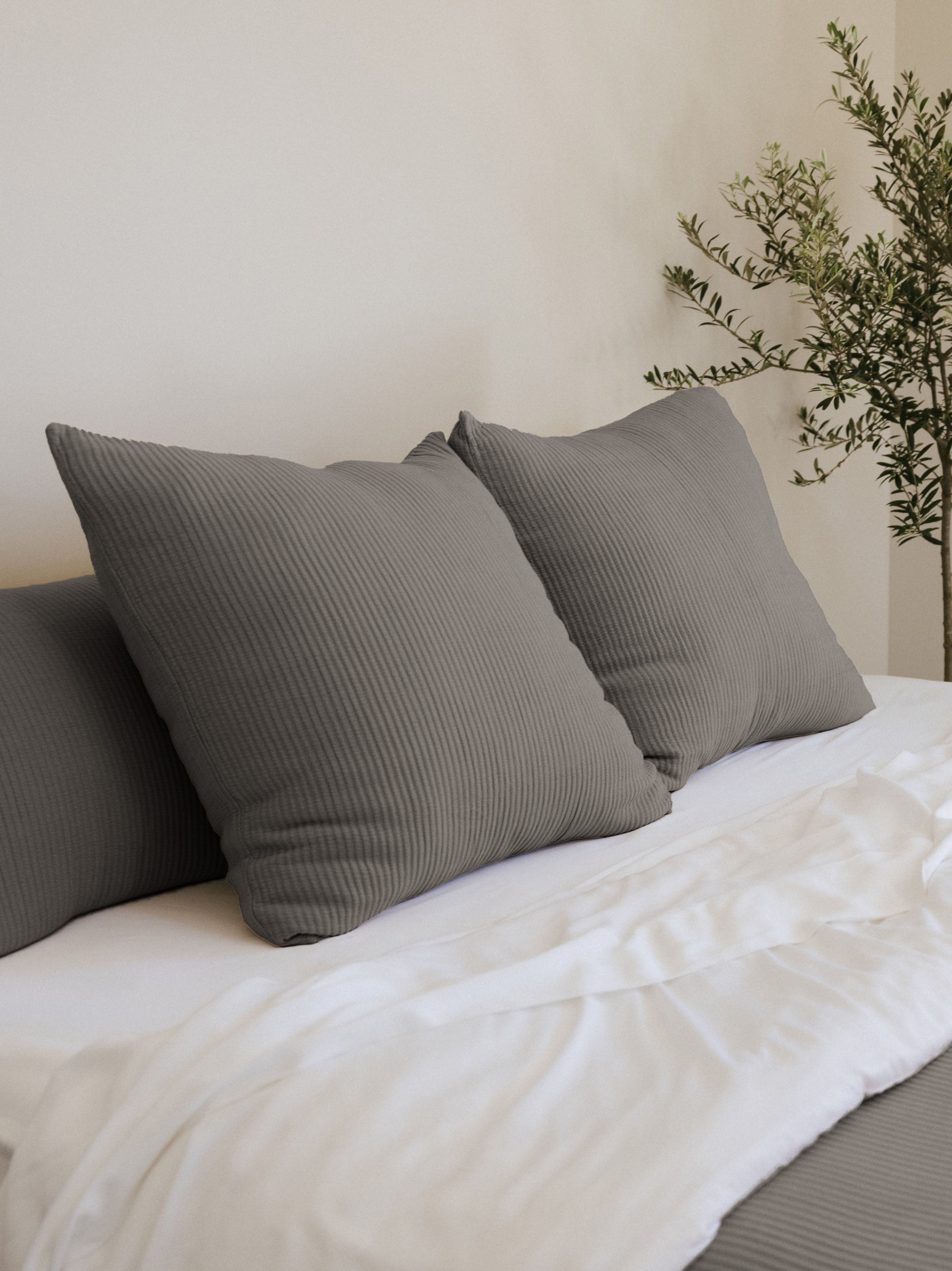 Charcoal coverlet shams on a white bed |Color:Charcoal