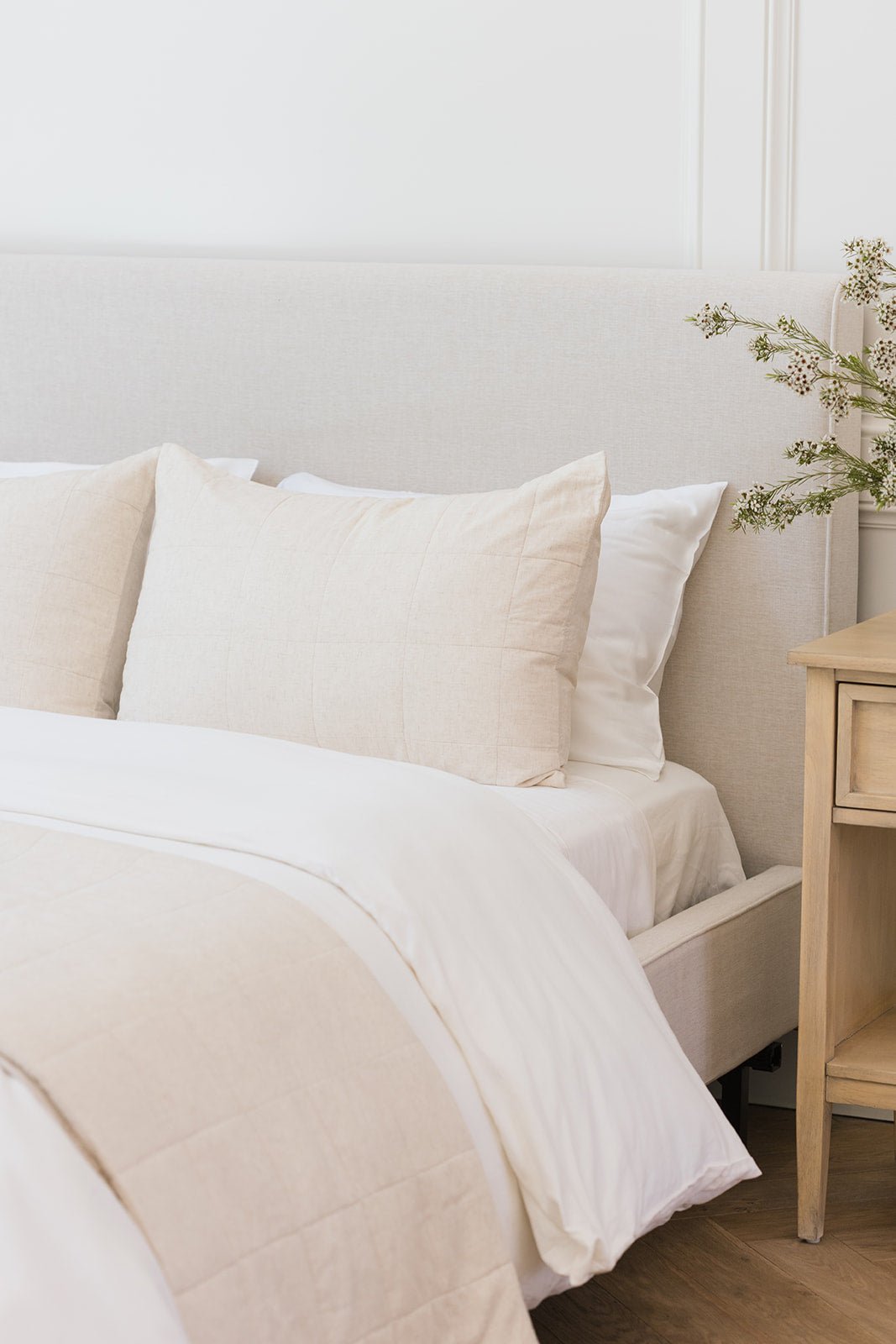 Natural Linen Box Quilt Sham laying on a bed. |Color: Natural