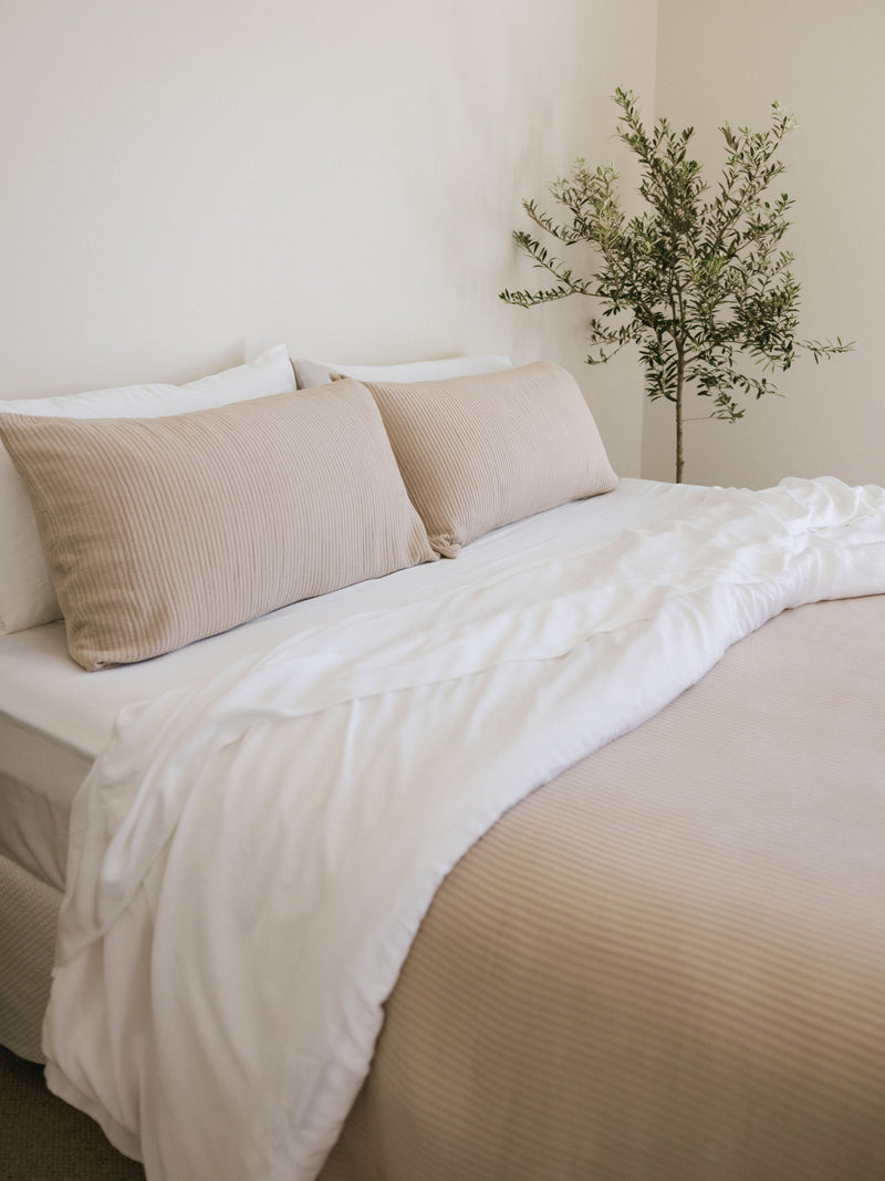 Driftwood coverlet and shams on a bed