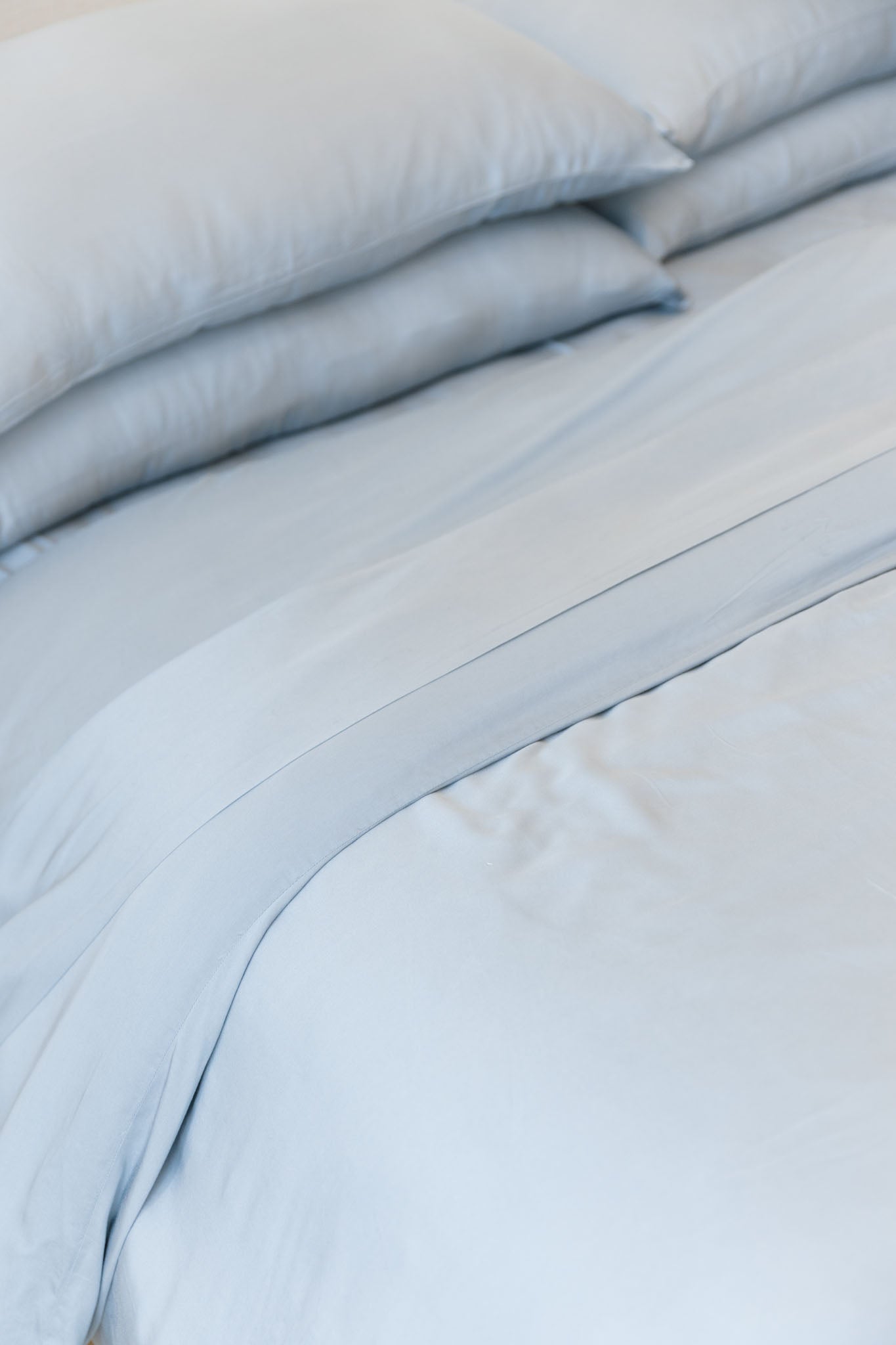 Close up of bed with harbor mist bedding standard/king/body