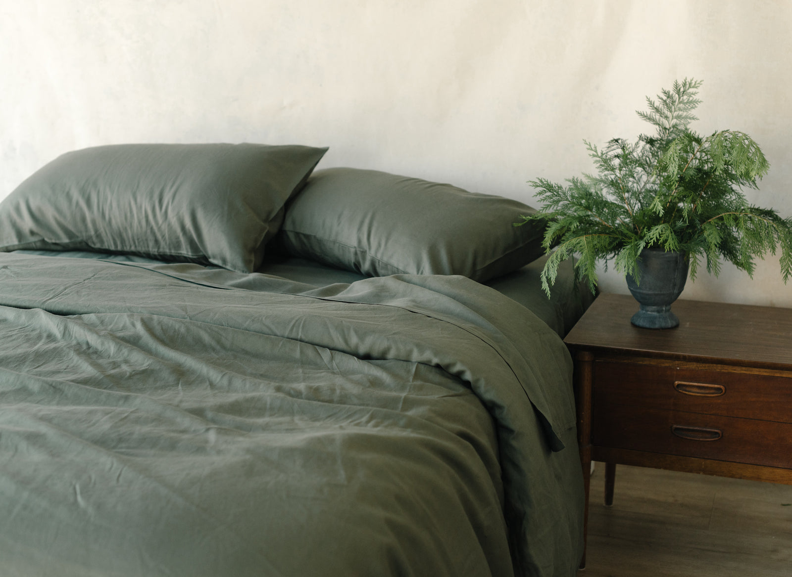 Olive Linen Bamboo Fitted Sheet on bed.  