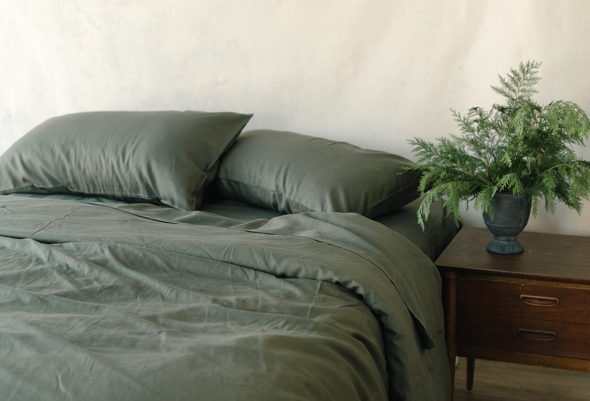 Olive Bamboo Linen Pillow Cases on a bed. |Color: Olive