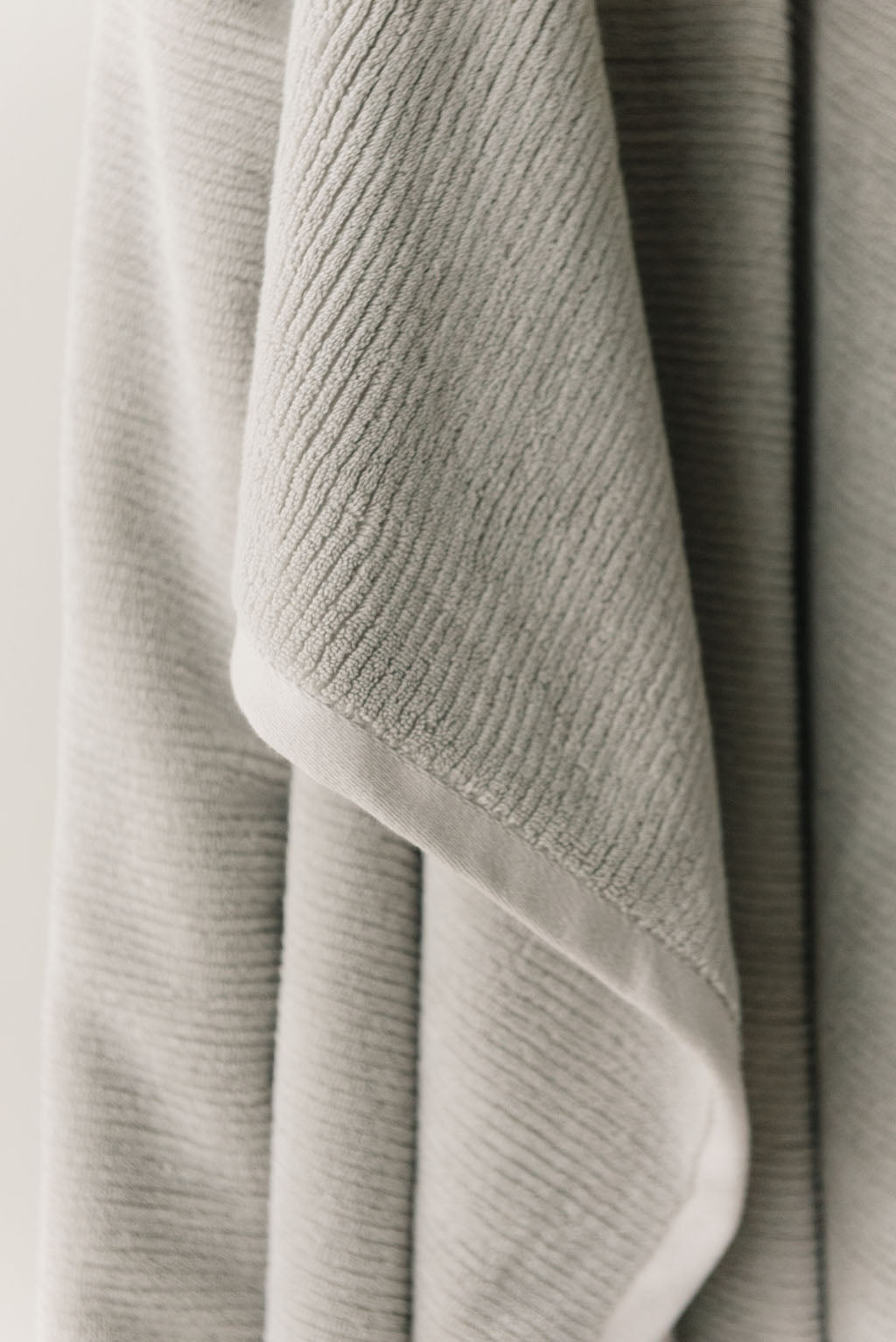 Ribbed Terry Bath Sheets in the color Light Grey. Photo of the towel is taken close up. 
