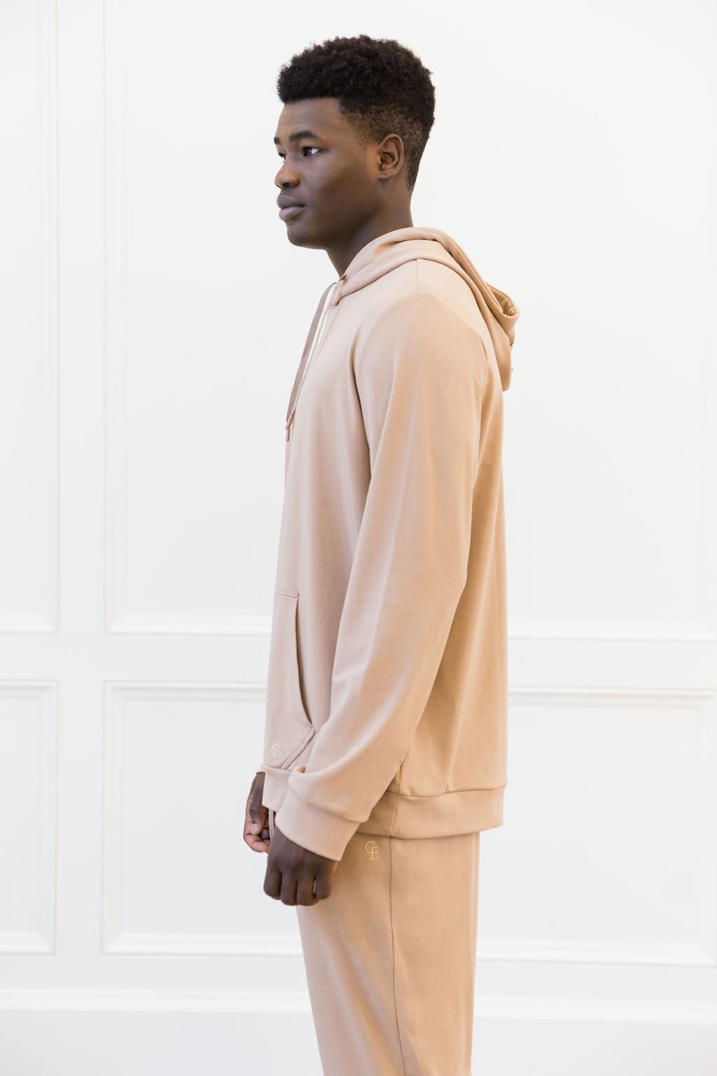 TImber Bamboo Hoodie worn by man standing in front of white background.