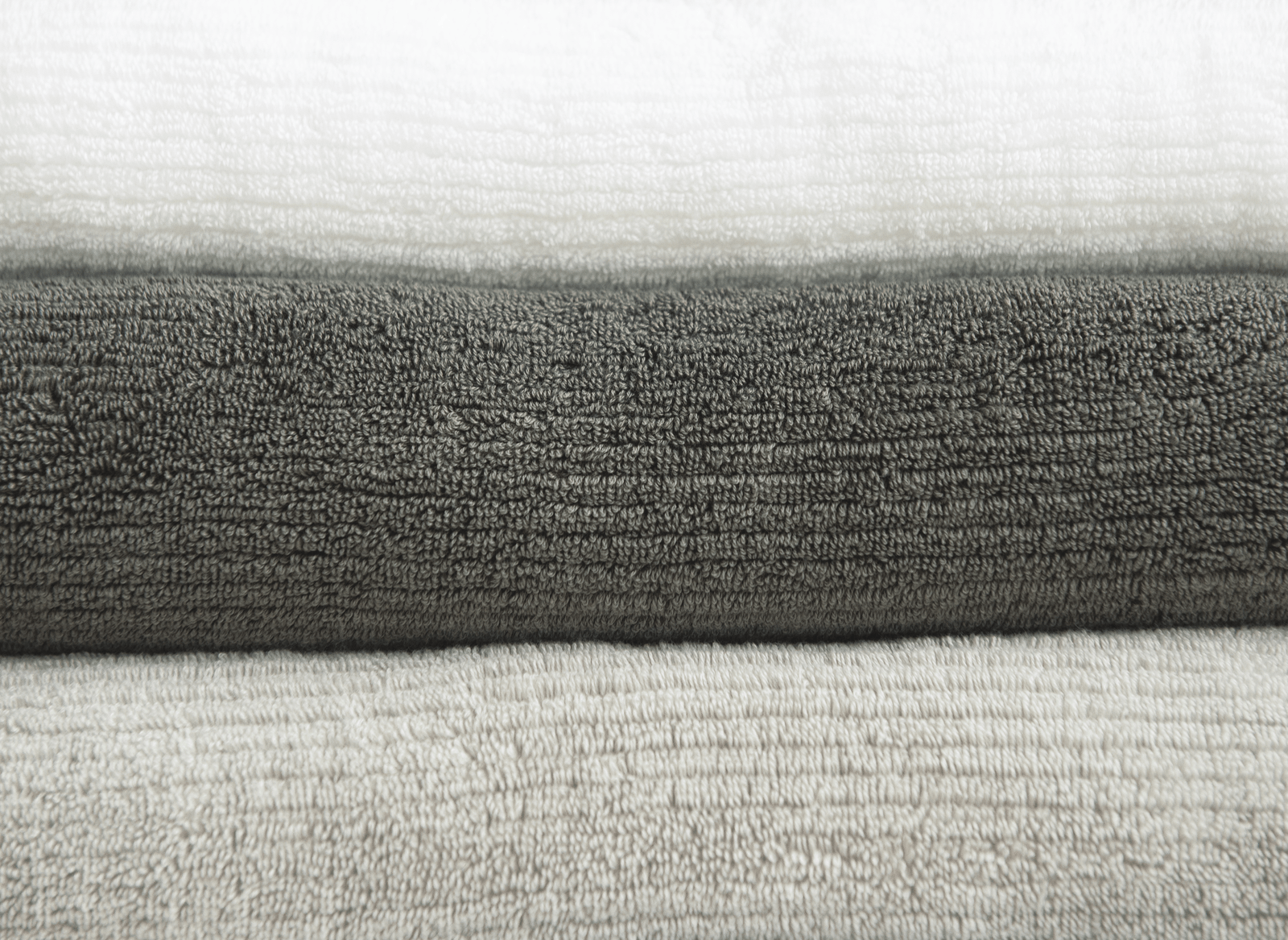Ribbed Terry Bath Sheets in the color Charcoal Light Grey White. Photo taken close up only showing the towels.
