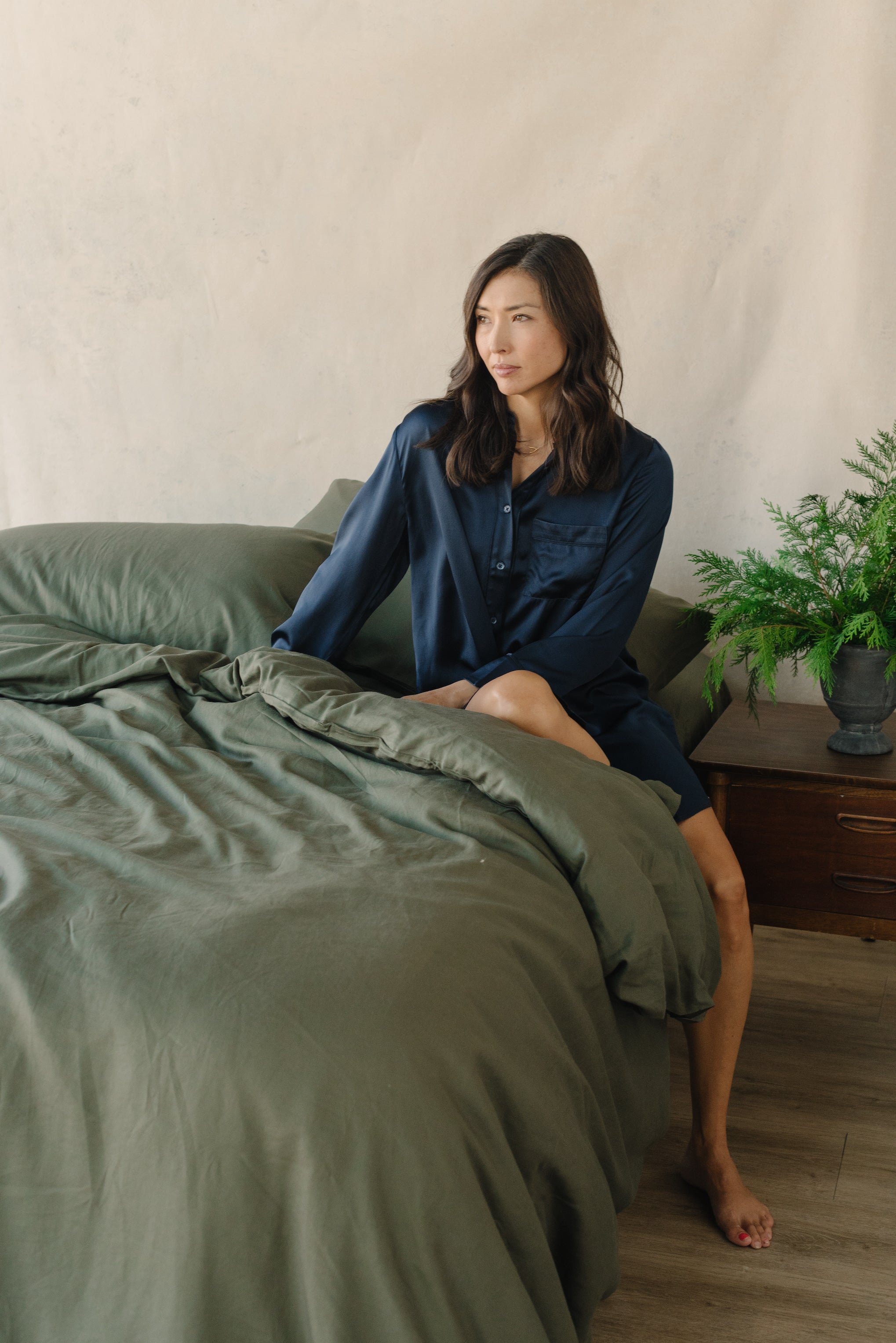 Olive Duvet Cover and comforter resting on a bed. 