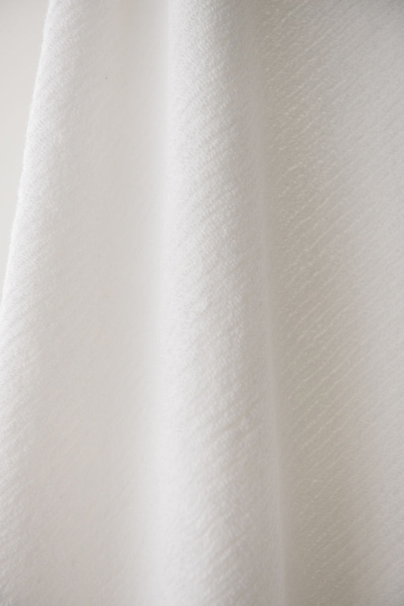 Ribbed Terry Bath Sheets in the color White. Photo of the towel is taken close up.