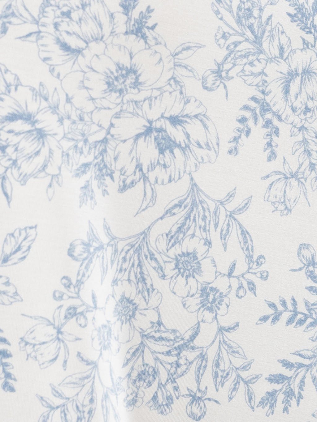 Close up of blue toile pajama fabric 