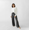 Charcoal Bamboo Wide Leg Patch Pocket Pant modeled by a woman. The photo was taken in a high contrast setting, showing off the colors and lines of the pajamas. |Color: Charcoal