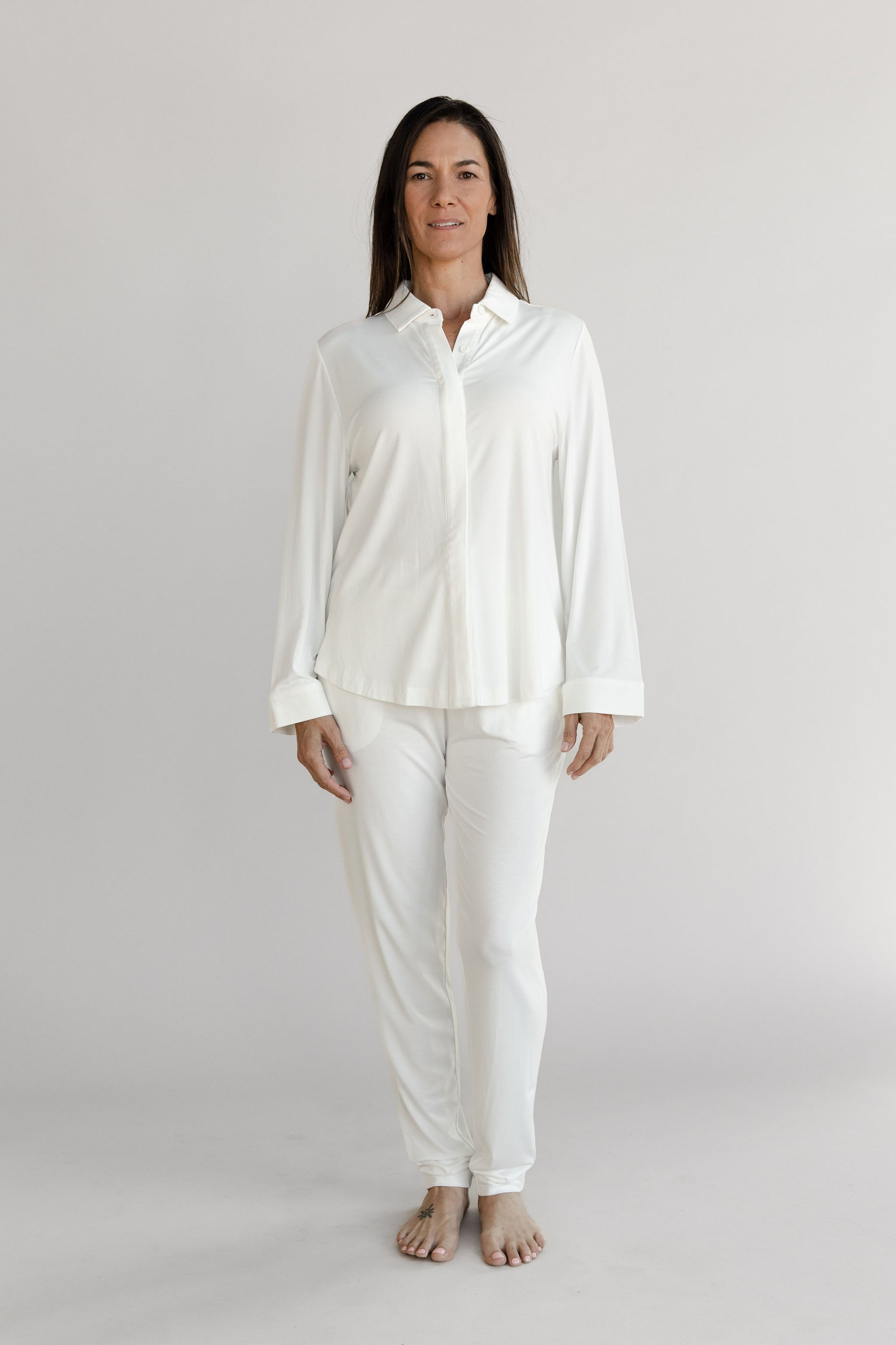Gray Cozy Earth Stretch Knit Tapered Pant set worn by a person on a light gray background 