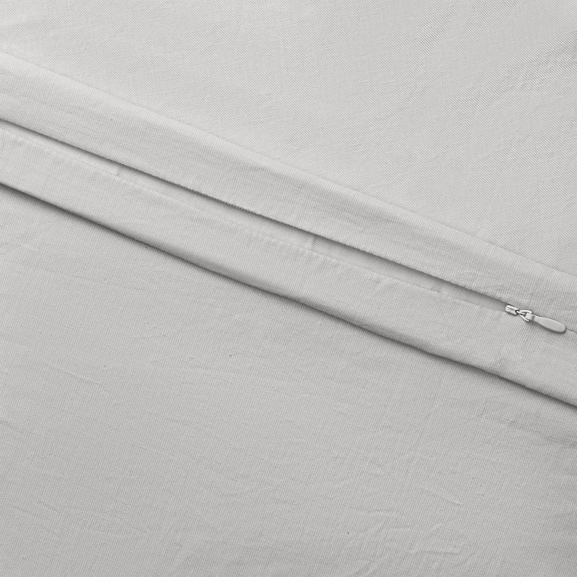 Light Grey Linen Bamboo Duvet Cover and comforter resting on a bed. Photo or product taken close up. 