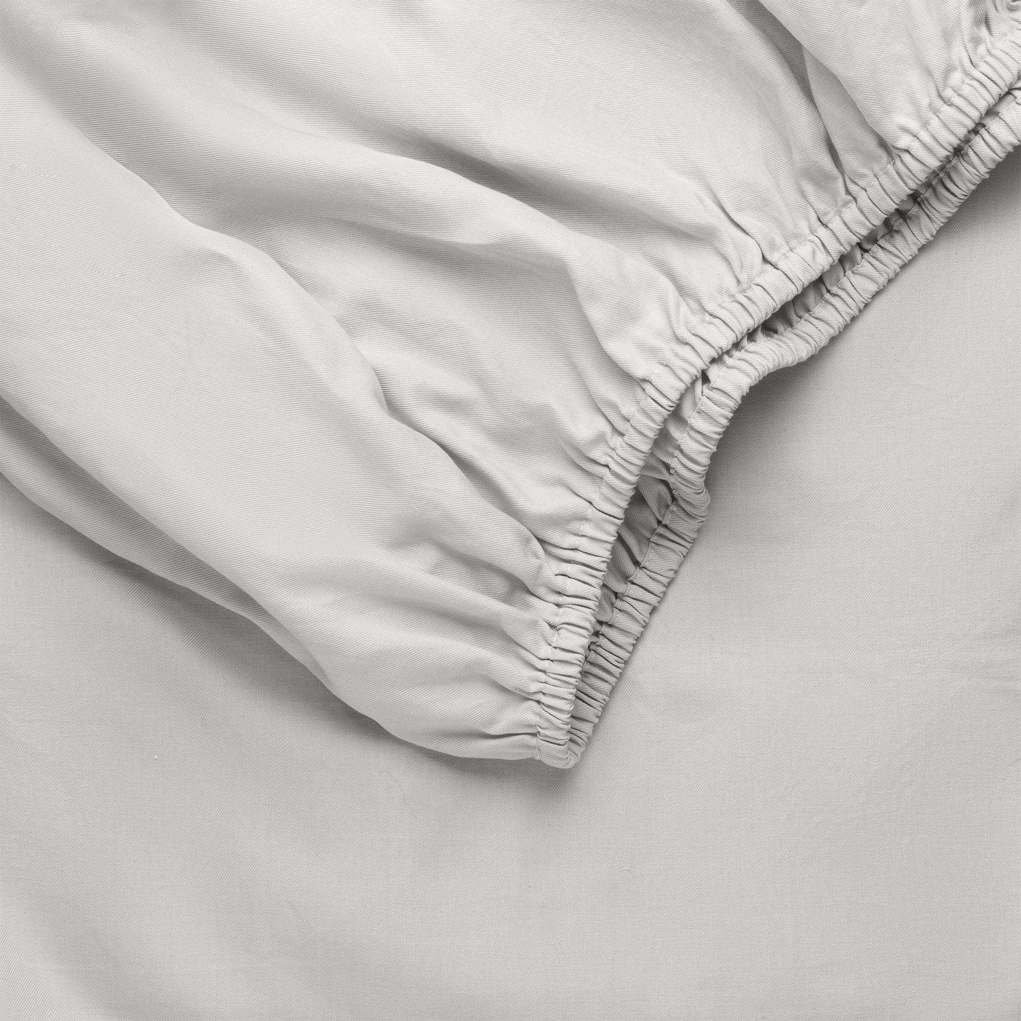 Light Grey Bamboo Linen Fitted Sheet Folded over itself. |Color: Light Grey