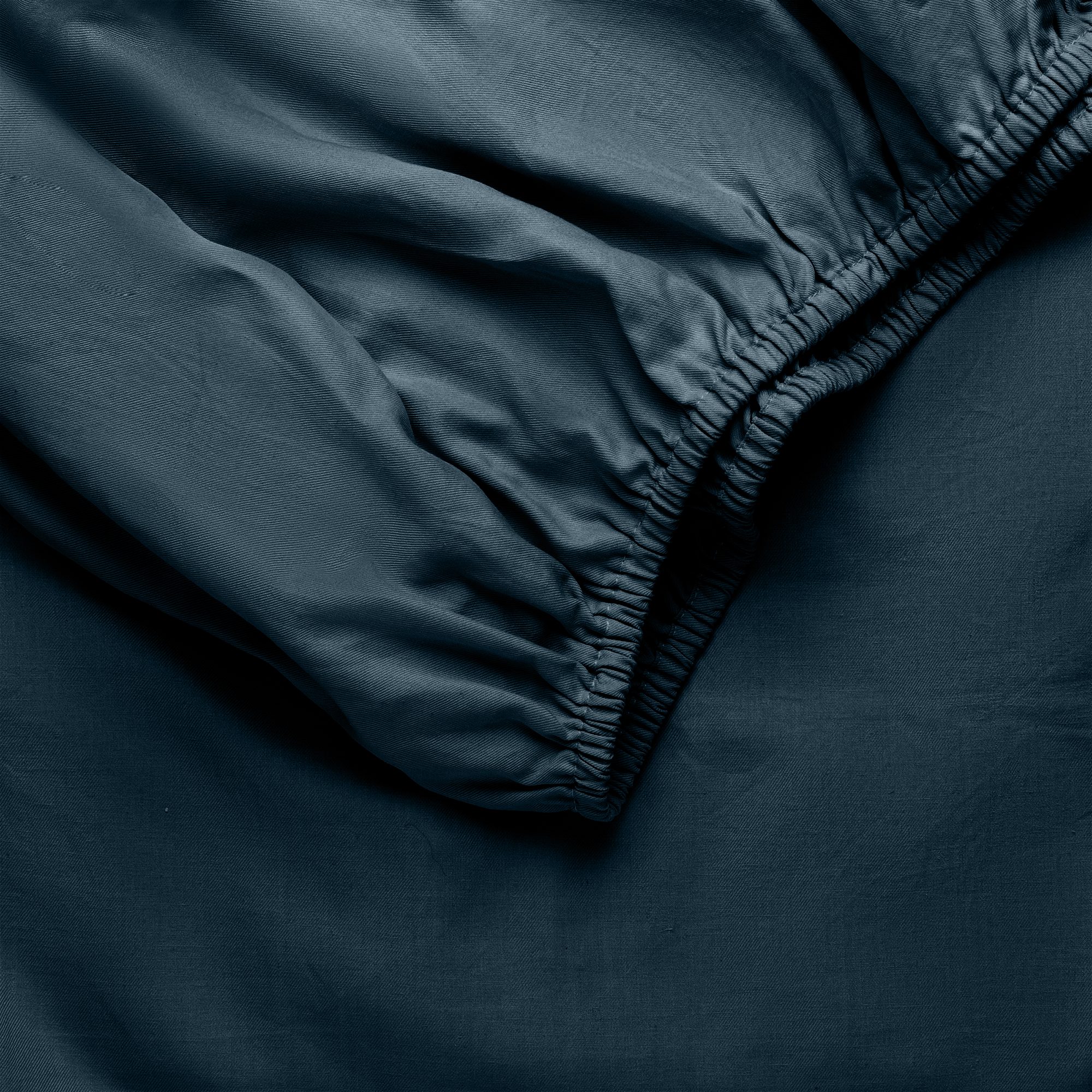 Navy Bamboo Linen Fitted Sheet Folded over itself. 