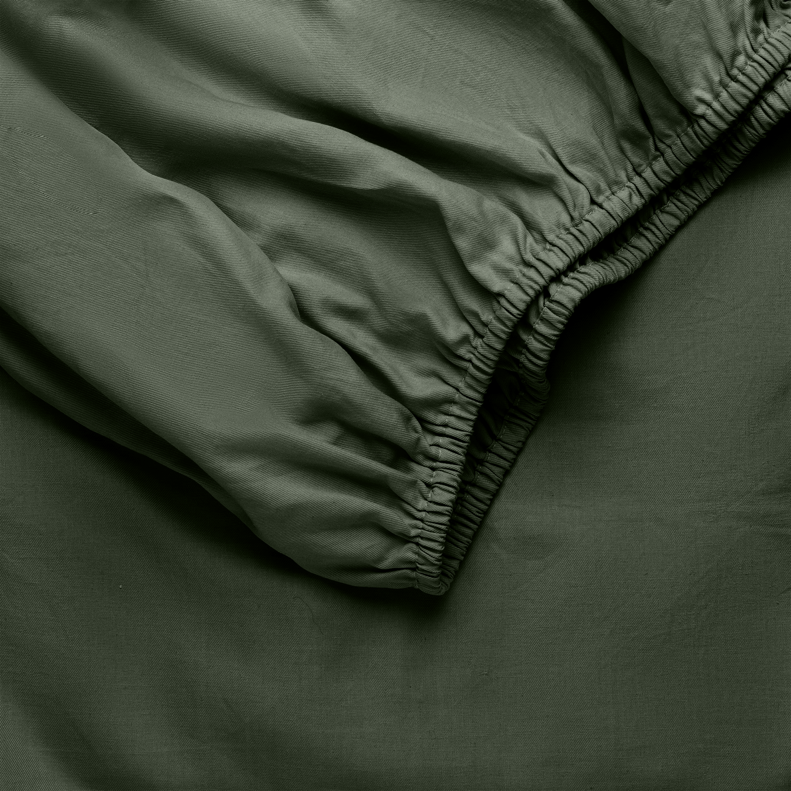 Olive Bamboo Linen Fitted Sheet Folded over itself. 
