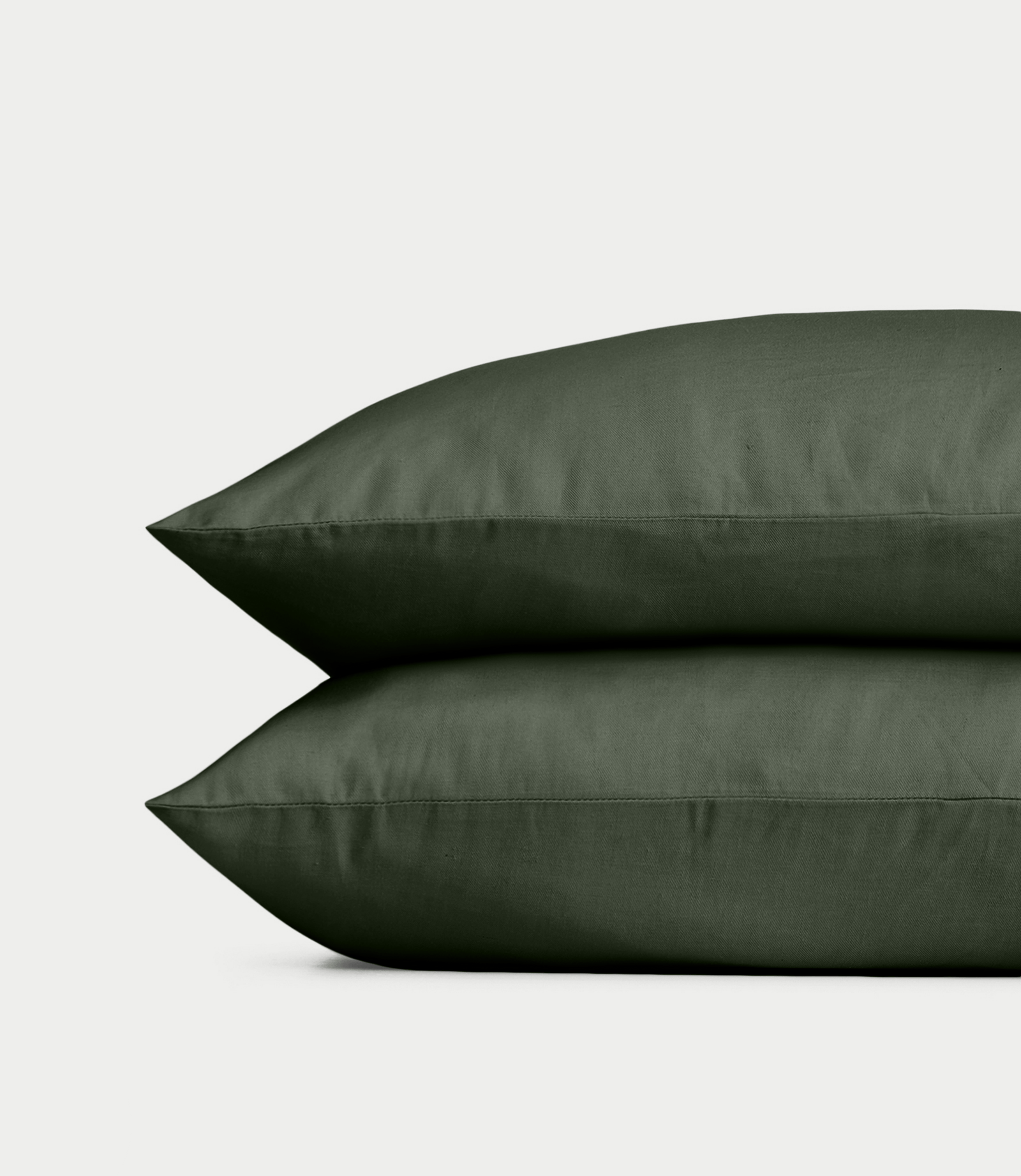Olive Linen Bamboo Pillow Shams photographed over a white background. 