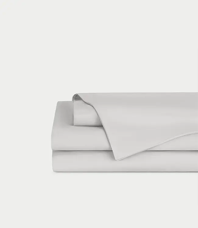 Light Grey Bamboo Linen Sheet Set neatly folded over a white background. 
