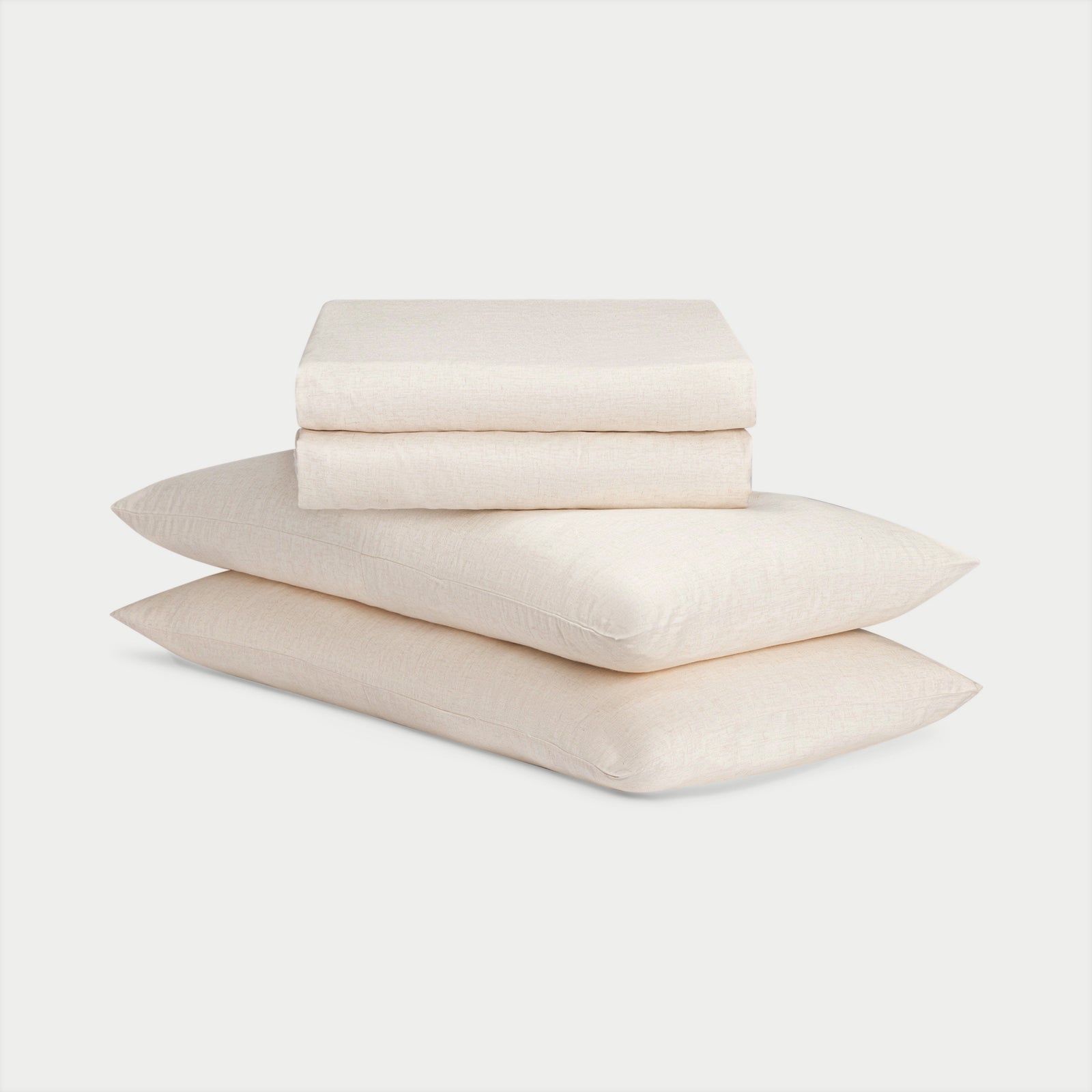Natural Bamboo Linen Sheet Set neatly folded over a white background. 