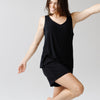 Woman wearing a black Cozy Earth Rib Knit Bamboo V-Neck Lounge Tank on a plain background |Color:Black