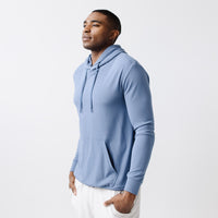 Blue Bamboo Hoodie worn by a man standing in front of white background.|Color:Blue