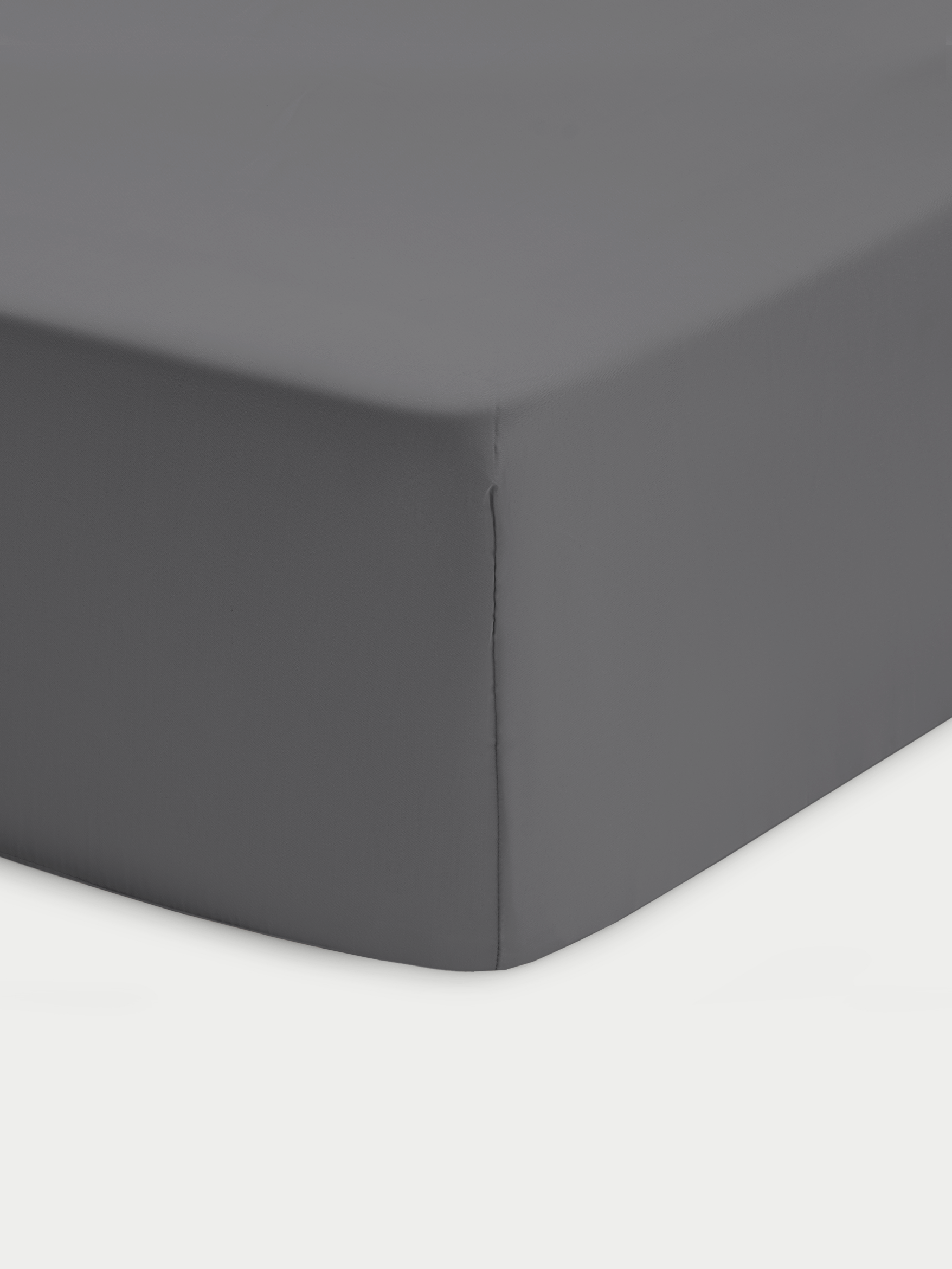 Corner of charcoal crib sheet with white background 