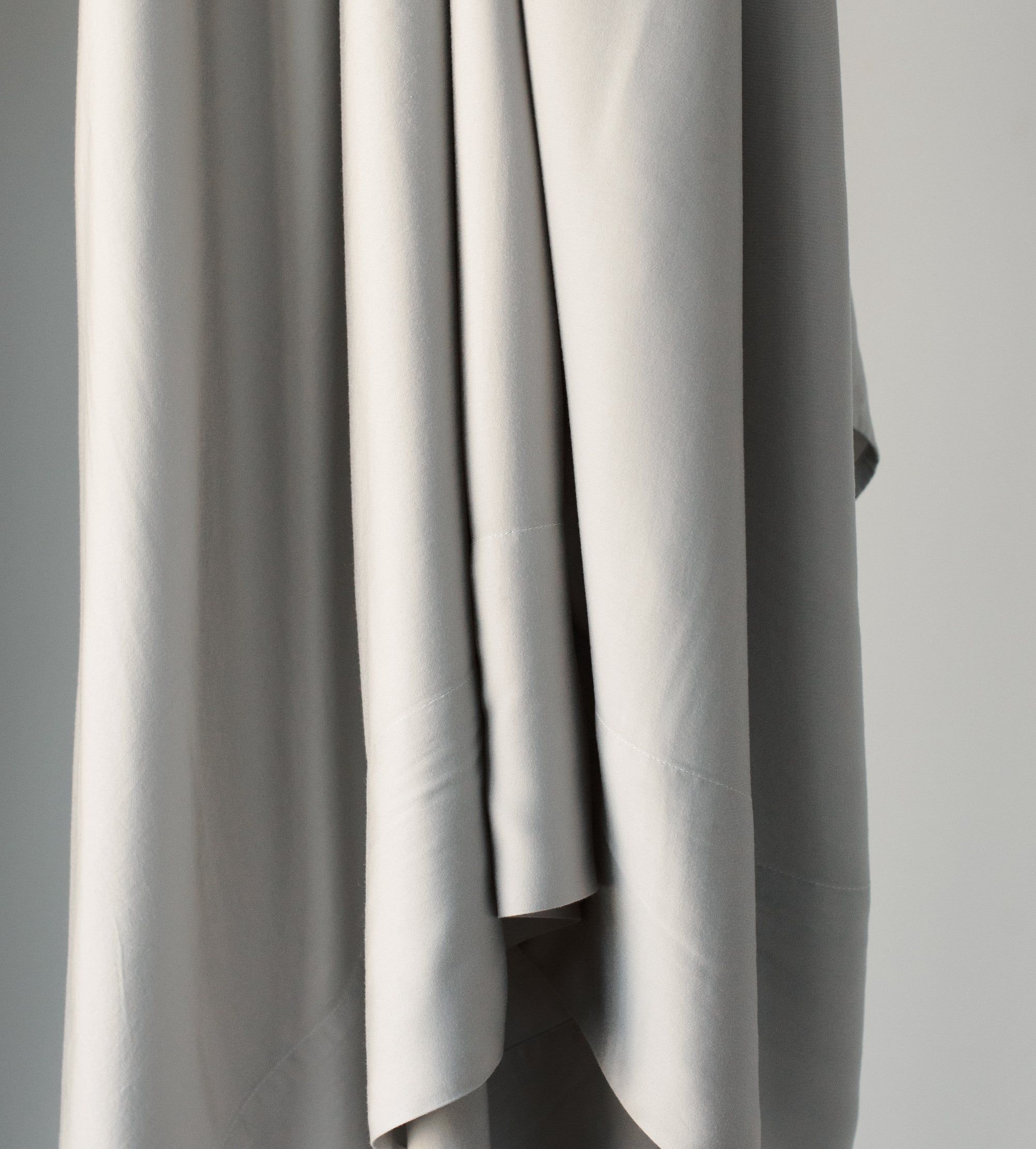 Light Grey sheet hanging down 