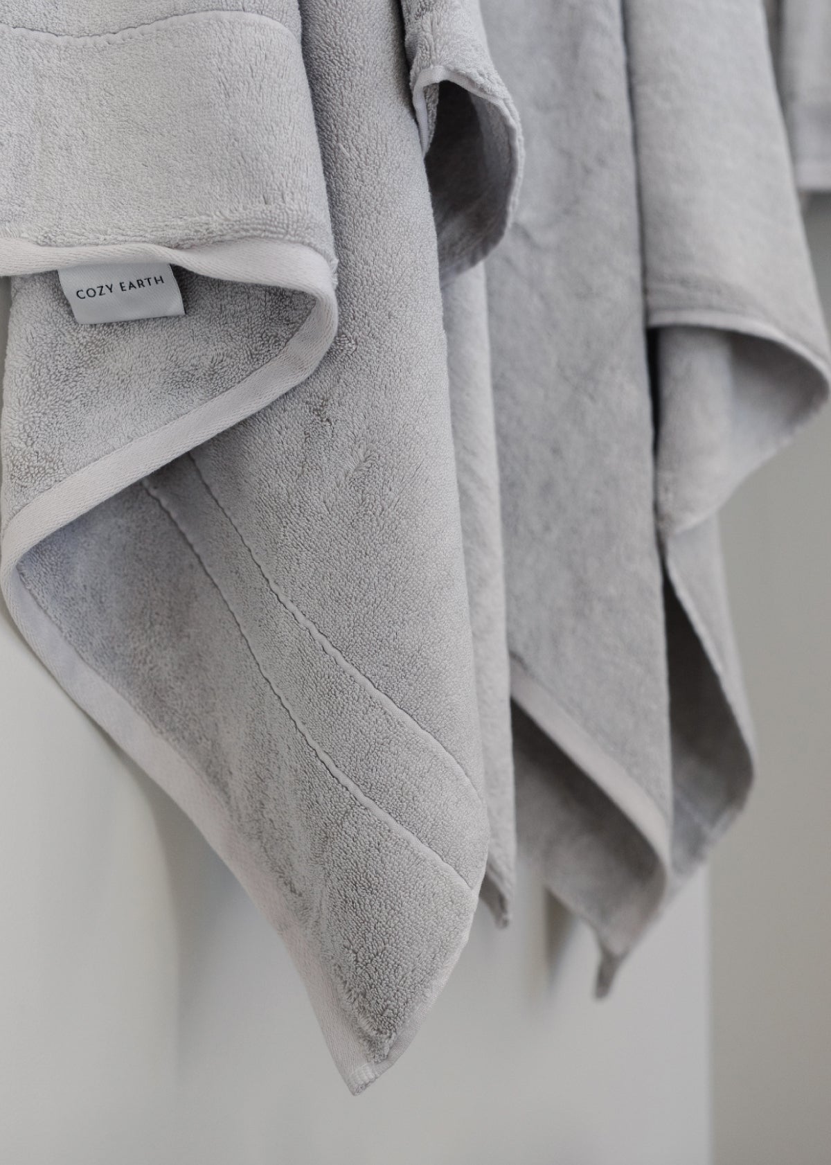 Premium Plush Bath Towel in the color Light Grey. Photo of Light Grey Premium Plush Bath Towel taken as a close up of the Premium Plush Bath Towel. 