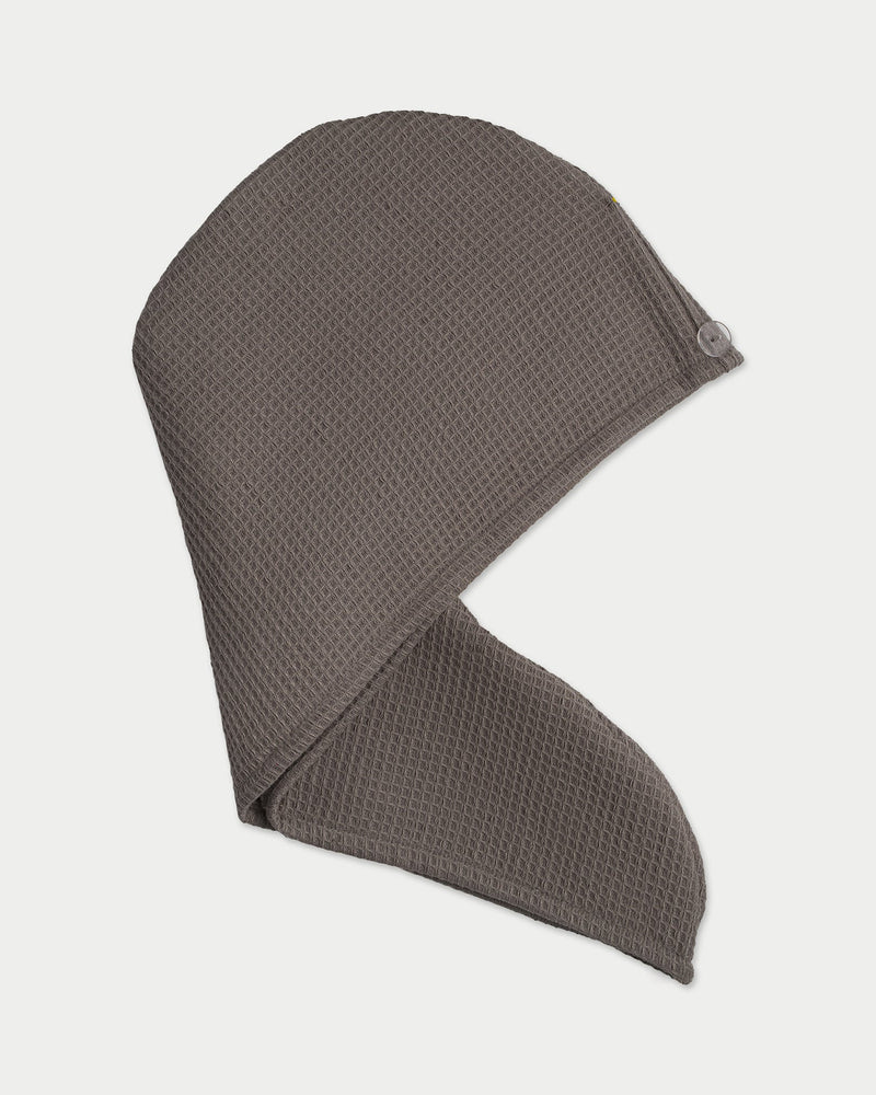 Charcoal Waffle Hair Towel. The hair towel is photo graphed with a white background.